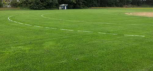 An athletic field in Leominster that receives regular fertilization treatments.
